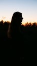 Silhouette of a girl at sunset Royalty Free Stock Photo