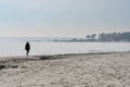 Silhouette of a person walking on the beach Royalty Free Stock Photo