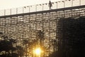 A silhouette of a person walking on the bleachers at the Toyota Grand Prix Race at the Indy Car World Series in Long Beach