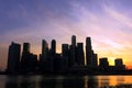 The silhouette photo of a group of buildings by the bay