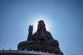 Silhouette photo of Guanyin buddha or `Goddess of Mercy ` statue on top of Xiqiao mountain Royalty Free Stock Photo