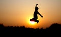 Silhouette photo of jumping young male boy during sunset