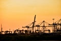 Silhouette photo during sunset, container lifting crane in Laem Chabang deep sea port