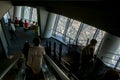 Silhouette photo of tourists in the Tokyo Sjytree dock who are look out through window glasses to see Fuji mountain and Tokyo city