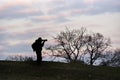 A silhouette photographer action during sunrise