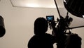Silhouette of photographer checking for movie camera. Royalty Free Stock Photo