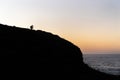 Silhouette of Photographer on a Hill Watching his Camera at Sunrise Time Royalty Free Stock Photo