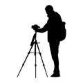 Silhouette of photographer holding camera with tripod vector illustration Royalty Free Stock Photo