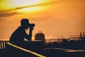 Silhouette of a photographer like to travel and photography, taking pictures of the beautiful city life sunset ,sunrise Royalty Free Stock Photo