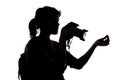 Silhouette of a Photographer With Money Gesture