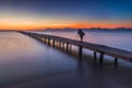 Silhouette of a photographer on pier, Alcudia