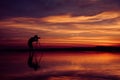 Silhouette Photographer take photo beautiful seascape at sunset Royalty Free Stock Photo