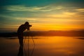 Silhouette Photographer take photo beautiful seascape at sunset Royalty Free Stock Photo