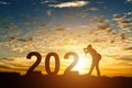 Silhouette of photographer taking photos in 2021 years