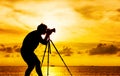 Silhouette of photographer with tripod