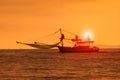 Silhouette photography of fishery boat and sunset sky over sea h