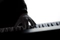 Silhouette of a pianist on a black and white background, the gloomy figure of a musician in the backlight Royalty Free Stock Photo