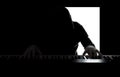 Silhouette of a pianist on a black and white background, the gloomy figure of a musician in the backlight Royalty Free Stock Photo