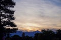 Silhouette of Pine Tree and Mountains at Dusk. Royalty Free Stock Photo