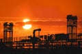 Silhouette pipelines system on crude oil tanker with blurred sunset sky Royalty Free Stock Photo