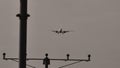 Silhouette of plane landing, runway lights Royalty Free Stock Photo