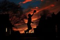 a silhouette of a player bouncing a basketball at dusk Royalty Free Stock Photo