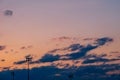 Silhouette of poles or column of spotlight or stadium light in arena with sunset beautiful sky cloud and with copy space Royalty Free Stock Photo