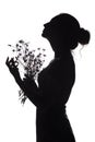 Silhouette profile of a beautiful girl with a bouquet of dried flowers on a white isolated background Royalty Free Stock Photo