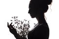 Silhouette portrait of a beautiful girl with a bouquet of dandelions, face woman profile on a white isolated background Royalty Free Stock Photo