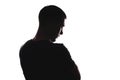 Silhouette portrait of Caucasian male pensive looking, from back looking down, isolated on white background Royalty Free Stock Photo