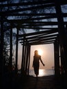 A sunset silhouette poses of woman on the beach Royalty Free Stock Photo