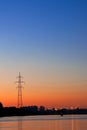 Silhouette of a power transmission line support Royalty Free Stock Photo