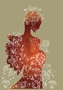 Silhouette of a pregnant white woman in flowers