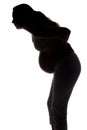 Silhouette of pregnant woman with backache Royalty Free Stock Photo