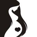 Silhouette of a pregnant woman with long hair Royalty Free Stock Photo