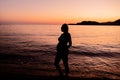 Silhouette of a pregnant woman on the seashore. Expectant mother expecting a baby Royalty Free Stock Photo