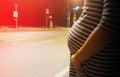 Silhouette pregnant woman standing alone on the road at night Royalty Free Stock Photo