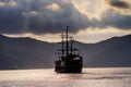 Silhouette prirate tourist ship sailing on Ashi lake