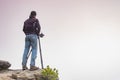 Silhouette of a professional photographer using a tripod Royalty Free Stock Photo