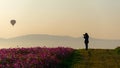 Silhouette professional woman photographer holding camera for take a photo balloon Royalty Free Stock Photo