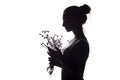 Silhouette profile of a beautiful girl with a bouquet of dried flowers on a white isolated background Royalty Free Stock Photo