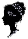 Silhouette profile of a cute lady s head. The girl has long beautiful hair, decorated with flowers. Suitable for advertising, logo Royalty Free Stock Photo