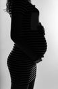 Silhouette profile of a pregnant woman