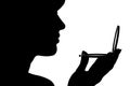 Silhouette profile of a woman face looking in a pocket mirror, the concept of the beauty and fashion Royalty Free Stock Photo