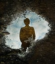 Silhouette and puddle Royalty Free Stock Photo