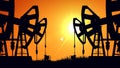 Silhouette pump jacks at sunset. Oil industry. Royalty Free Stock Photo