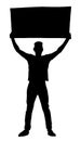 Silhouette of a Punk Male or Female Protester Holding Protest Banner in Air