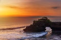 Silhouette of Pura Batu Bolong in golden sunset it the traditional Balinese temple located on a rocky, in the Tanah Lot area, Bali