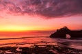Silhouette of Pura Batu Bolong in golden sunset it the traditional Balinese temple located on a rocky, in the Tanah Lot area, Bali