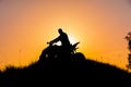 Silhouette of quad bike driver on the mountain Royalty Free Stock Photo